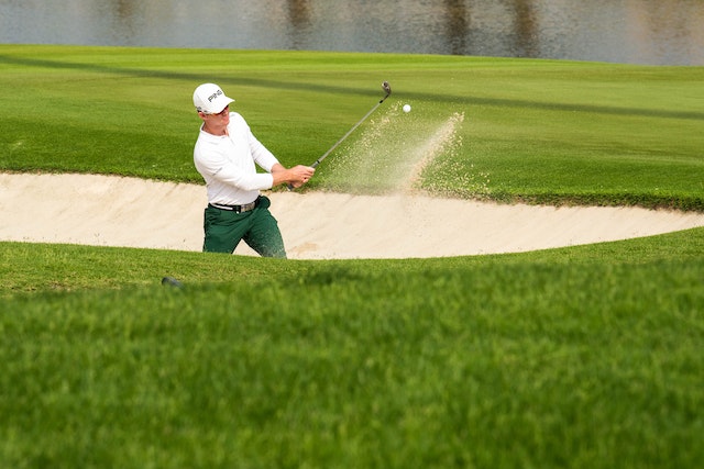 Golfer playing from the sand hazard 