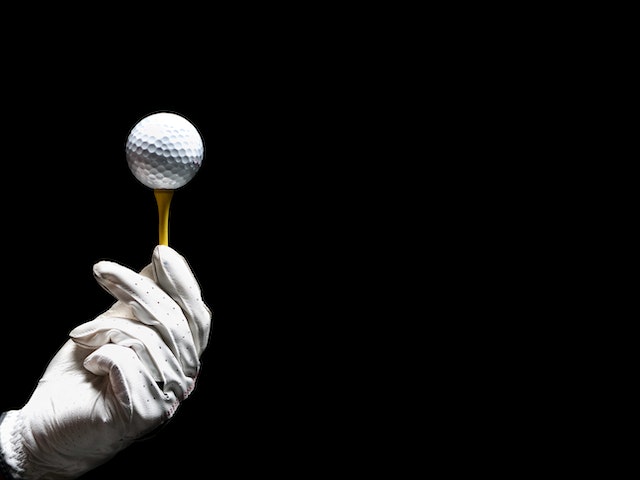 Gold ball on black background 