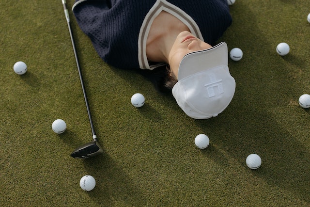Golfer on the grass suffering injury 